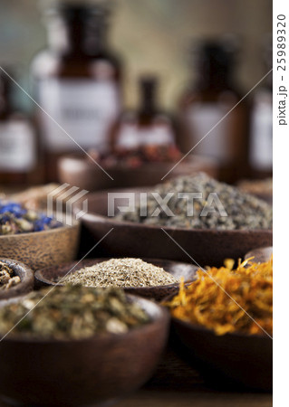 Medicine bottles and herbs background 25989320