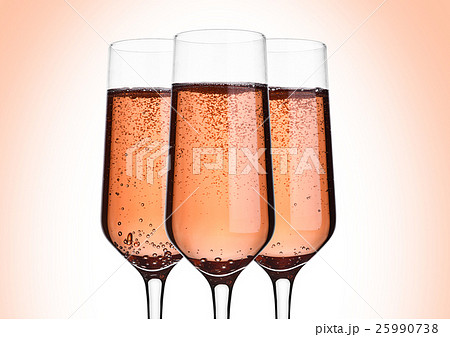 Glass of pink rose champagne with bubbles on pink 25990738