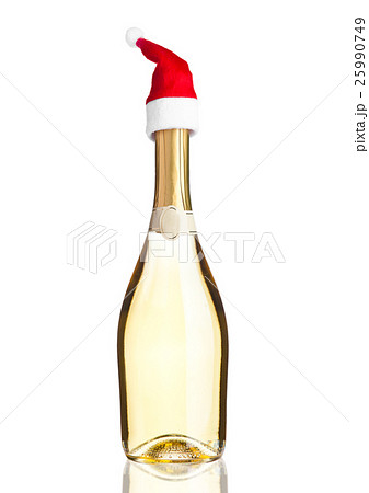 Bottle of yellow champagne with santa hat white Bottle of yellow champagne with santa hat white 25990749