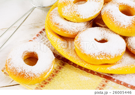Donuts with caster sugar on checkered napkin Donuts with caster sugar on checkered napkin 26005446