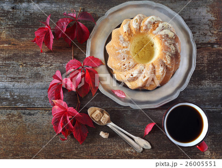 Homemade Kouglof, cup of coffee and  red leaves 26005551