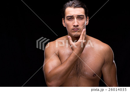 Man after taking shower on dark background 26014035