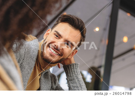 face of a happy guy listening something 26014798