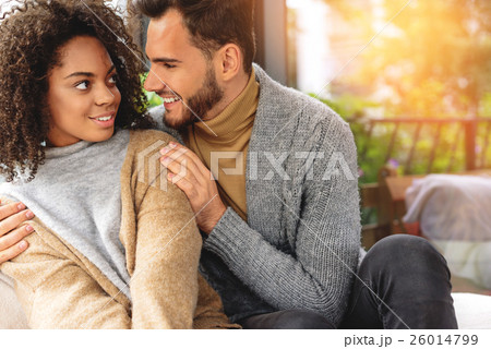 man hugging his smiling wife 26014799