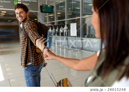 Pretty loving couple separating before flight 26015248