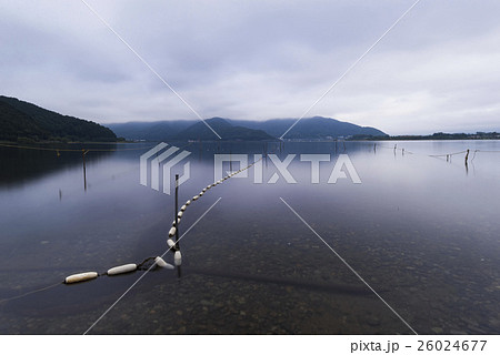 Fisherman floats on Lake Kawaguchiko, Yamanashi Fisherman floats on Lake Kawaguchiko, Yamanashi 26024677