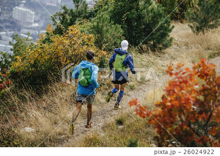 two men running mountain trail two men running mountain trail 26024922