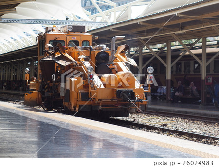 Large heavy railroad service machine at a station Large heavy railroad service machine at a station 26024983