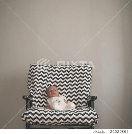 cute newborn baby sitting in the big chair cute newborn baby sitting in the big chair 26029365