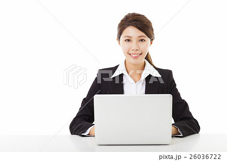 smiling young business woman working with laptop smiling young business woman working with laptop 26036722