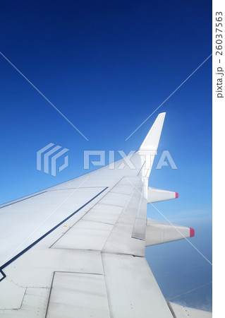 Wing of an airplane on blue sky Wing of an airplane on blue sky 26037563