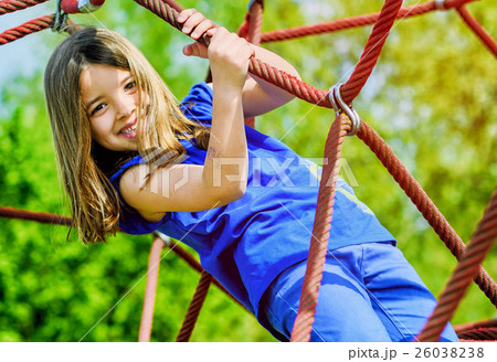 kid girl doing rock climbing 26038238