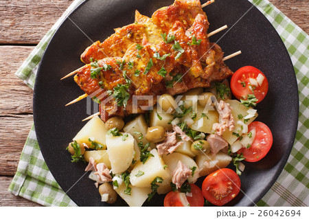 Spanish kebab Pinchos Morunos and salad Spanish kebab Pinchos Morunos and salad 26042694