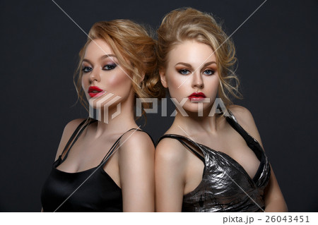 Two beautiful girls in evening dresses Two beautiful girls in evening dresses 26043451