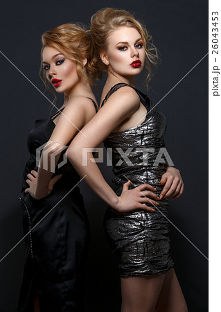 Two beautiful girls in evening dresses 26043453
