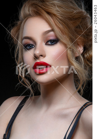 Beautiful girl in black classic dress 26043463