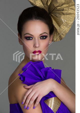 Brunette girl with purple make-up 26043523
