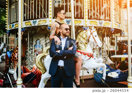 adult man and woman on a carousel adult man and woman on a carousel 26044554