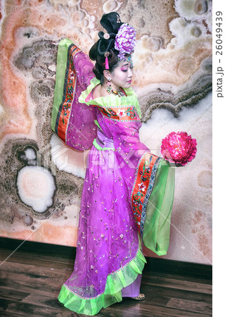 Asian style portrait of a woman with flower 26049439