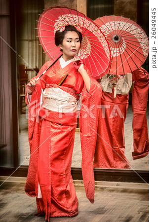 geisha in red kimono with parasol geisha in red kimono with parasol 26049445