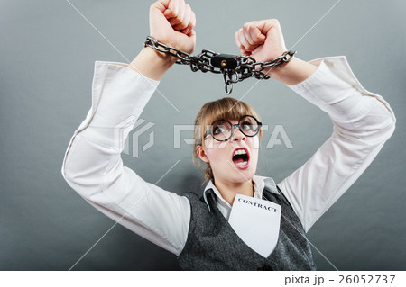 Business woman with chained hands 26052737