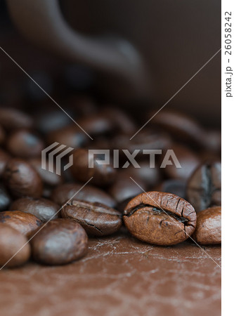 Coffee cup and roasted coffee beans Coffee cup and roasted coffee beans 26058242