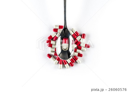Capsules over silver spoon, Healthcare Medicine Capsules over silver spoon, Healthcare Medicine 26060576