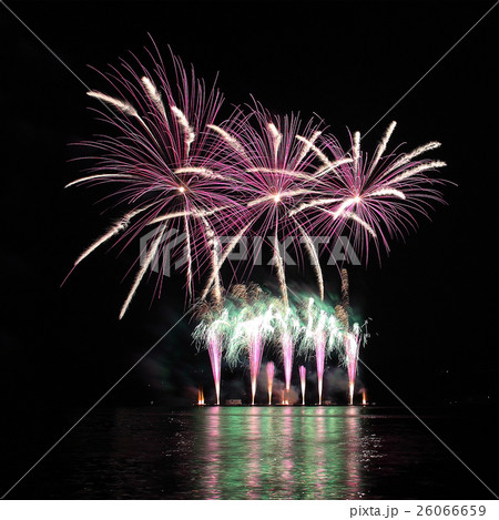 Colorful fireworks with reflection on lake. 26066659