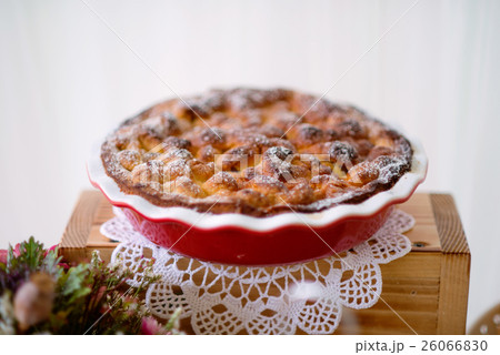 Table with sweet pie in red porcelain tray laid on Table with sweet pie in red porcelain tray laid on 26066830