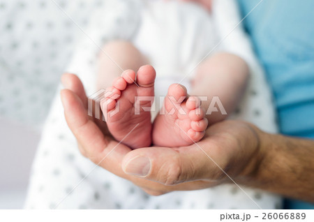 Unrecognizable father with newborn baby son, legs Unrecognizable father with newborn baby son, legs 26066889