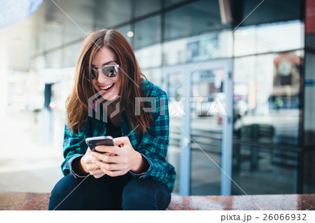 Portrait of urban fashionable girl using smart Portrait of urban fashionable girl using smart 26066932
