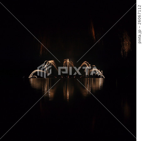 Colorful fireworks with reflection on lake. 26067112