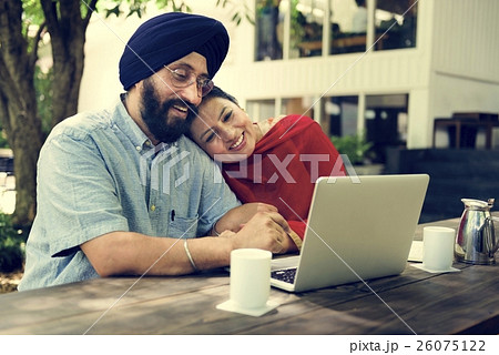 Indian Couple Using Device Concept 26075122