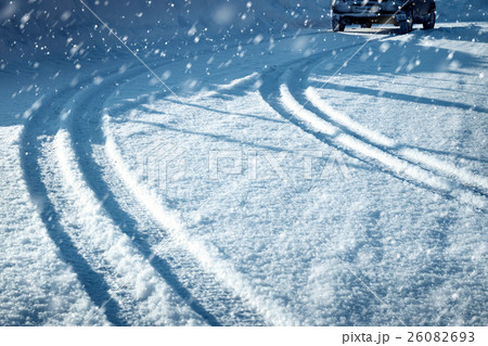 Car tires on winter road Car tires on winter road 26082693