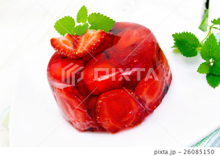 Jelly strawberry with mint on light board 26085150