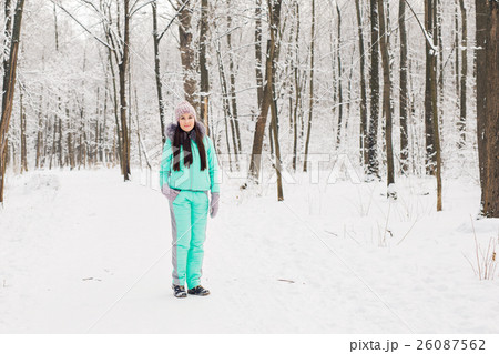 Beautiful young girl in a white winter forest Beautiful young girl in a white winter forest 26087562