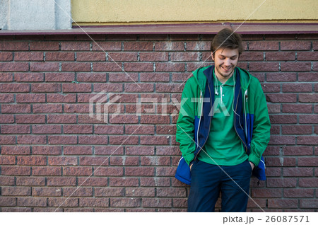 Common young man wearing green t-shirt jacket and Common young man wearing green t-shirt jacket and 26087571