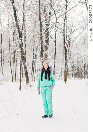Beautiful young girl in a white winter forest Beautiful young girl in a white winter forest 26087572