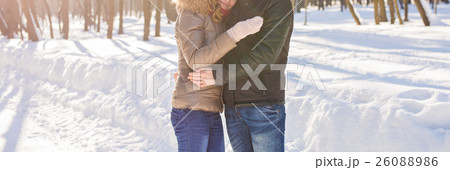 Close-up of Young Couple in Winter Park having fun Close-up of Young Couple in Winter Park having fun 26088986