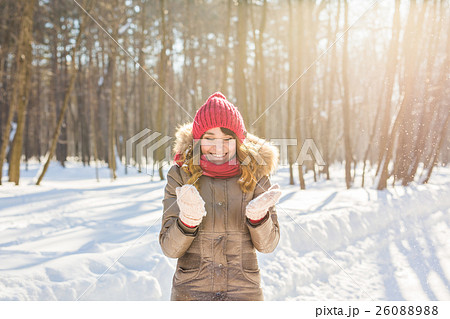 Beauty Girl Blowing Snow in frosty winter Park Beauty Girl Blowing Snow in frosty winter Park 26088988