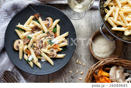 Pasta with mushrooms on rustic tabletop. Pasta with mushrooms on rustic tabletop. 26089685