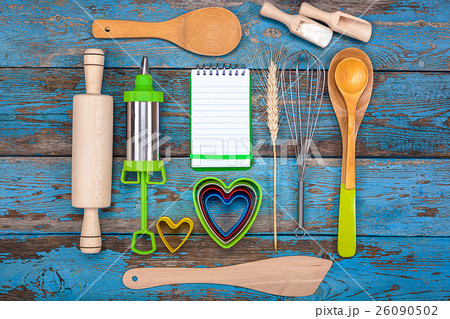 Set kitchen utensils and a notebook for recipes 26090502