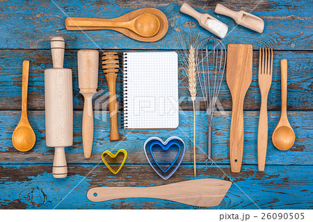 Set kitchen utensils and a notebook for recipes 26090505