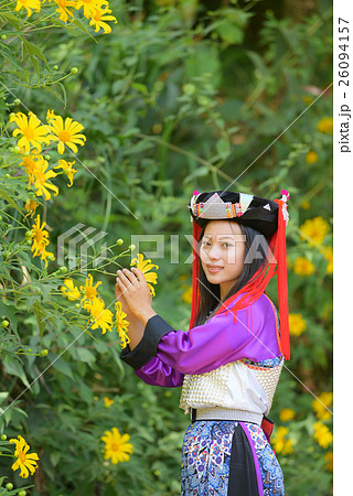 Beautiful Lahu tribe girl hold mexico sunflower 26094157