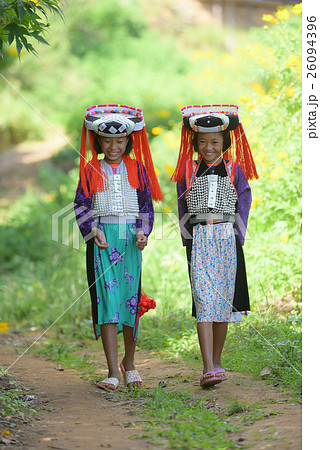 Happy beautiful Lahu tribe among mexico sunflower 26094396