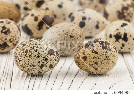 Quail eggs on old white wooden table. 26094906