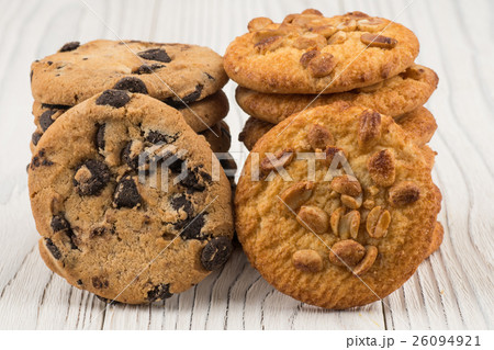 Biscuits with chocolate and peanut on table. Biscuits with chocolate and peanut on table. 26094921