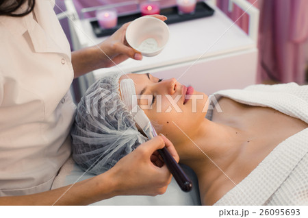 Young beautiful woman having spa procedure on her 26095693