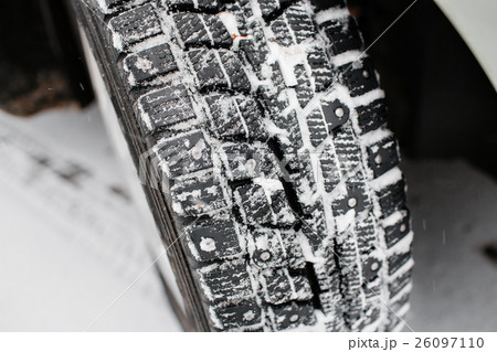 Closeup of car tires in winter. the first snow in 26097110