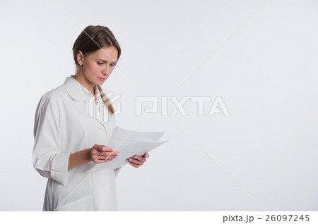 Portrait of cheerful female doctor with documents Portrait of cheerful female doctor with documents 26097245